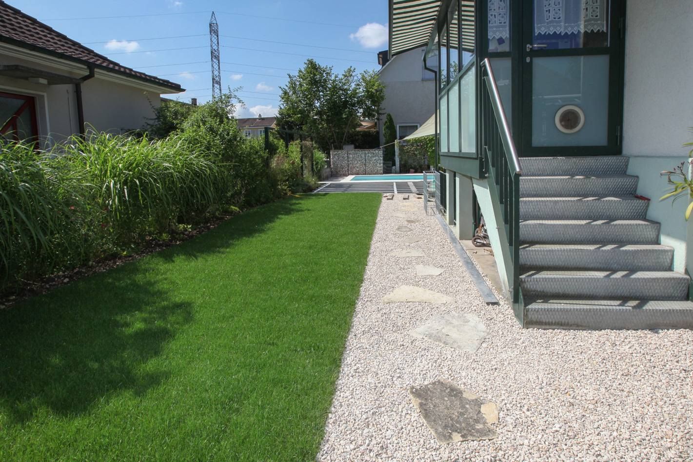 HS Gartenbau GmbH Terrasse mit Treppe zum Haus